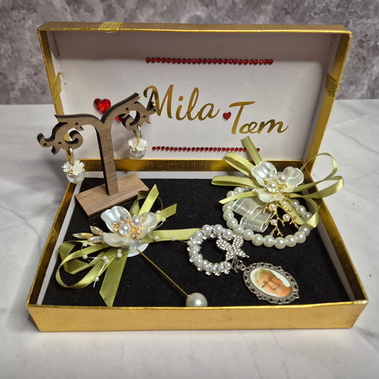 Wedding gift box with a pearl earring, pin charm, and a match corsages