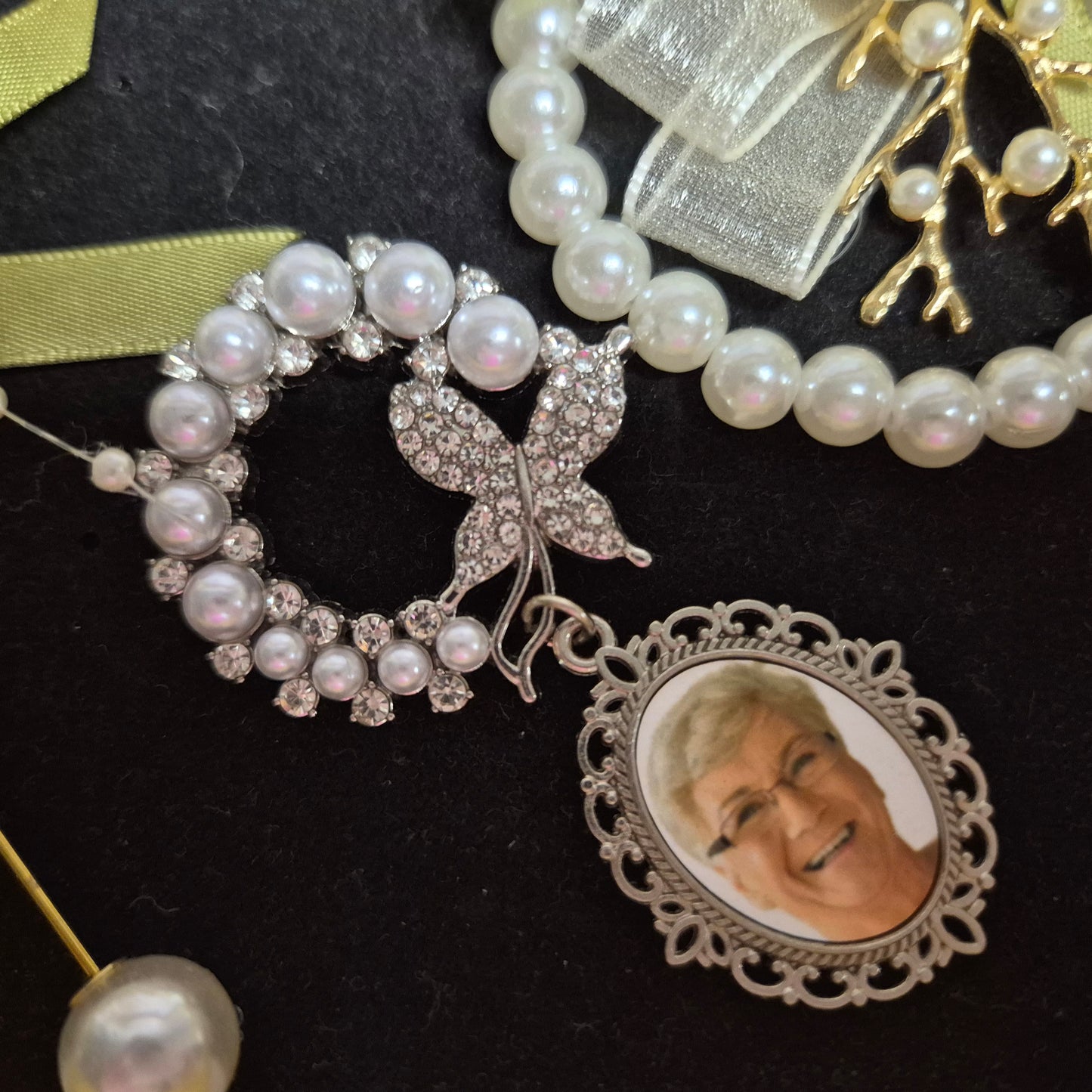Wedding gift box with a pearl earring, pin charm, and a match corsages