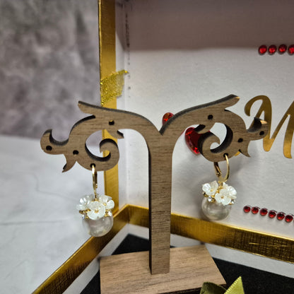Wedding gift box with a pearl earring, pin charm, and a match corsages