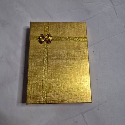 Wedding gift box with a pearl earring, pin charm, and a match corsages