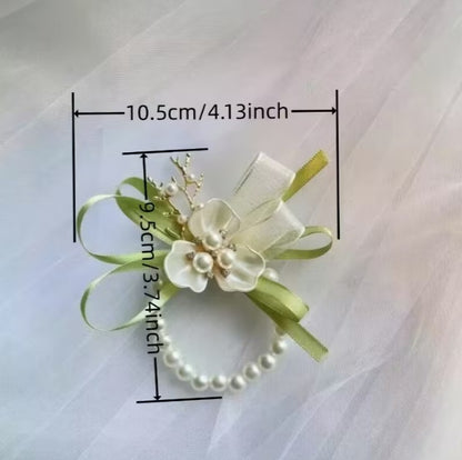 Wedding gift box with a pearl earring, pin charm, and a match corsages