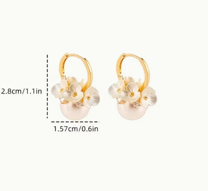Wedding gift box with a pearl earring, pin charm, and a match corsages