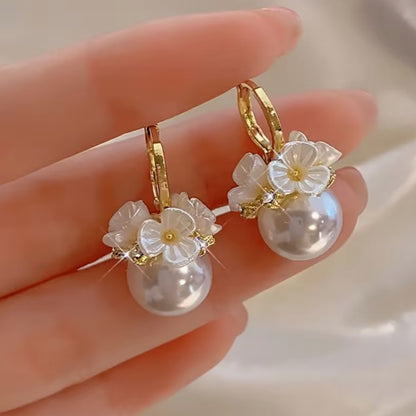 Wedding gift box with a pearl earring, pin charm, and a match corsages