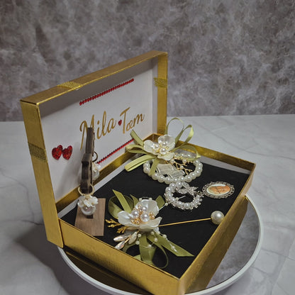 Wedding gift box with a pearl earring, pin charm, and a match corsages